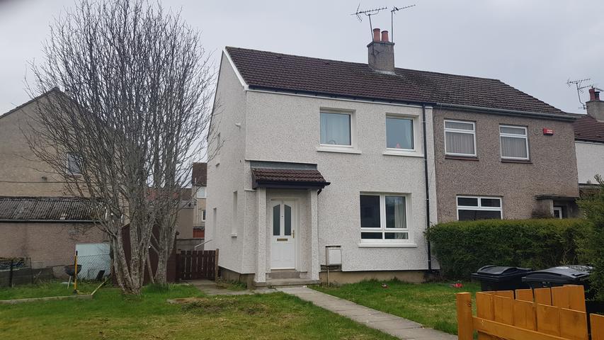 Semi-detached house finished in white dry dash