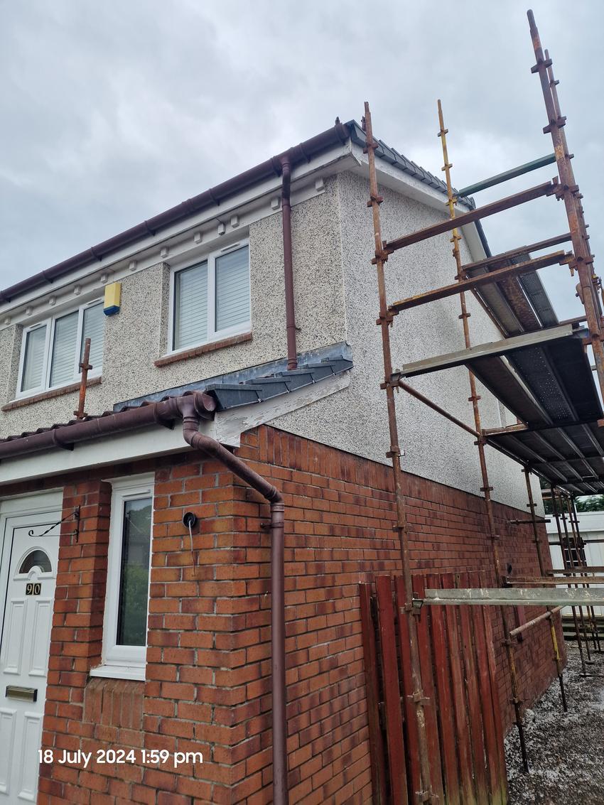 Finished dry dash gable with new lead flashing above the porch roof